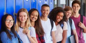 high school students gather in front of the lockers
