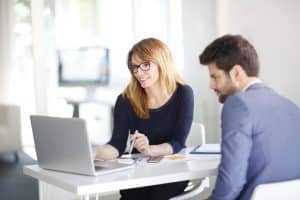 Consultant and student talking in a conference 