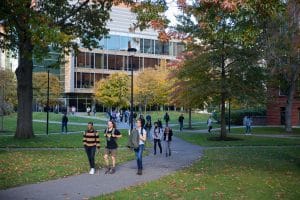 Views of diverse students leaving class outside the Northwest Labs in Autumn.