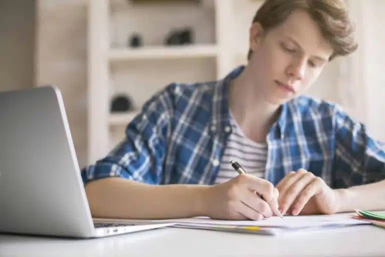students writing an essay about overcoming a challenge