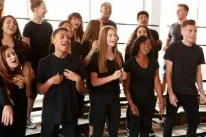 students practice singing