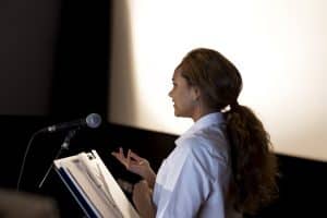 a female student on an open mic
