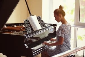 a young student playing piano