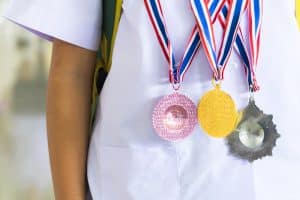medals hanging on a student's neck
