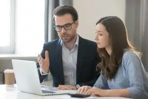 A man is explaining while a woman listens to him.