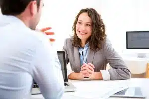 Young student smiling at her interviewer.