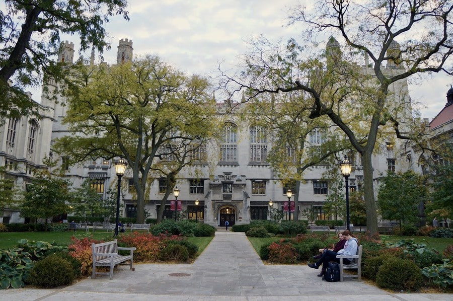 Main building of the University of Chicago surrounded by trees.