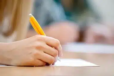 Writing an essay on a table.