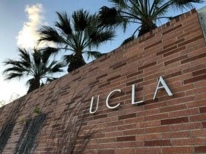Entrance sign to UCLA campus bearing the school name.