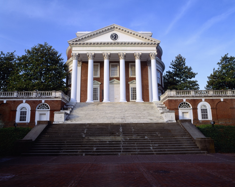 Front view of University of Virginia's campus building with trees on each side.
