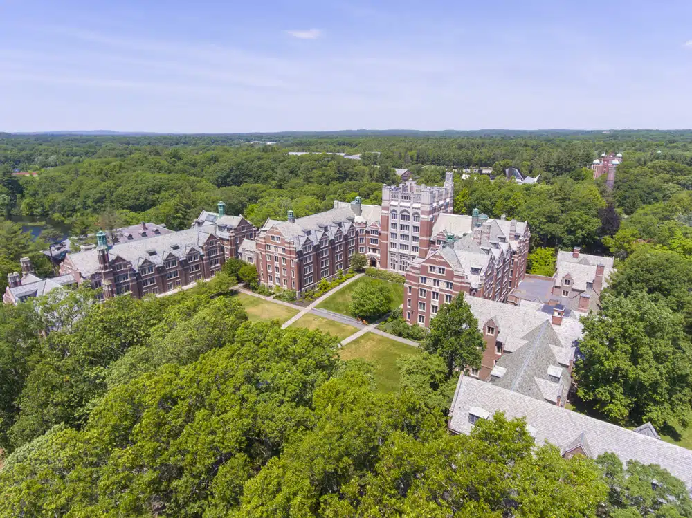 Aerial view of Wellesley College and its surrounding buildings and trees.
