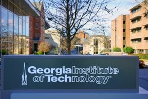 Signage of Georgia Tech's name and logo at the entrance of the campus.