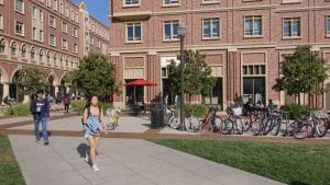 University of Southern California campus scene with students and bicycles in the background.