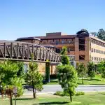 A view of the UC Irvine campus with modern buildings and greenery, representing the university’s academic excellence and competitive UC Irvine acceptance rate