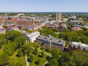 Aerial view of Brown University campus with its buildings and tall trees around.