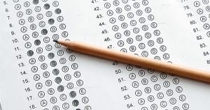 Standardized test form with answers bubbled in and a pencil.