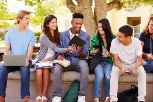 International students talking in a bench.