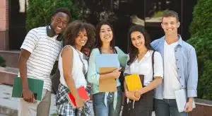 Group of students smiling in the camera.