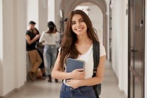 Young woman smiling in the school halls.