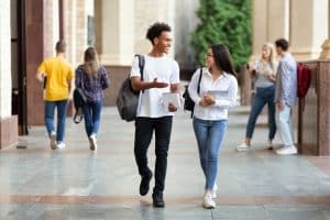 Two students walking in the school halls.