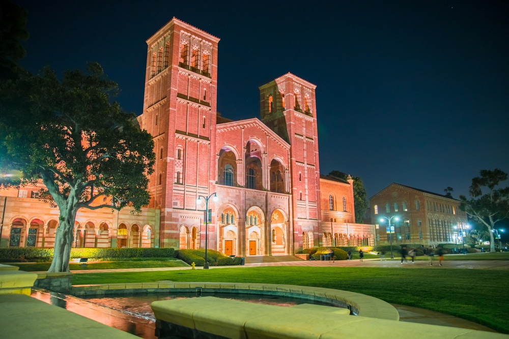 View of UCLA building at night with lights surrounding the whole place.
