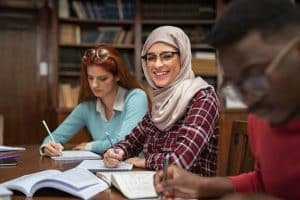 Students working on a library while working.