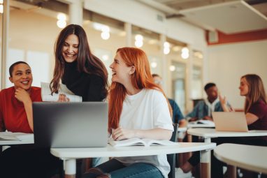 Students working on something while in the classroom.