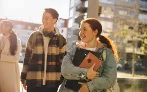 Students walking in the walkways of a campus.