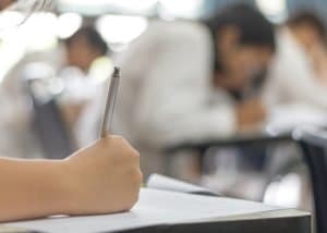 Taking an exam in a desk.