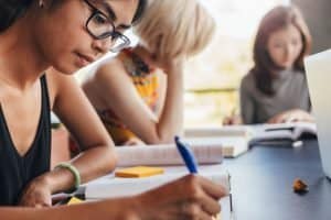 Female students studying in a table.