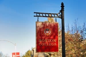 Signage of Boston college hanged in a post.