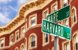 Signage of Harvard placed near a building.