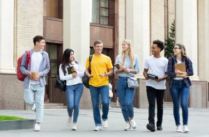 Students walking in front of a building.