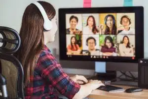 Young woman attending and online course using a computer.