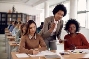 College professor explaining to her students about a lesson.