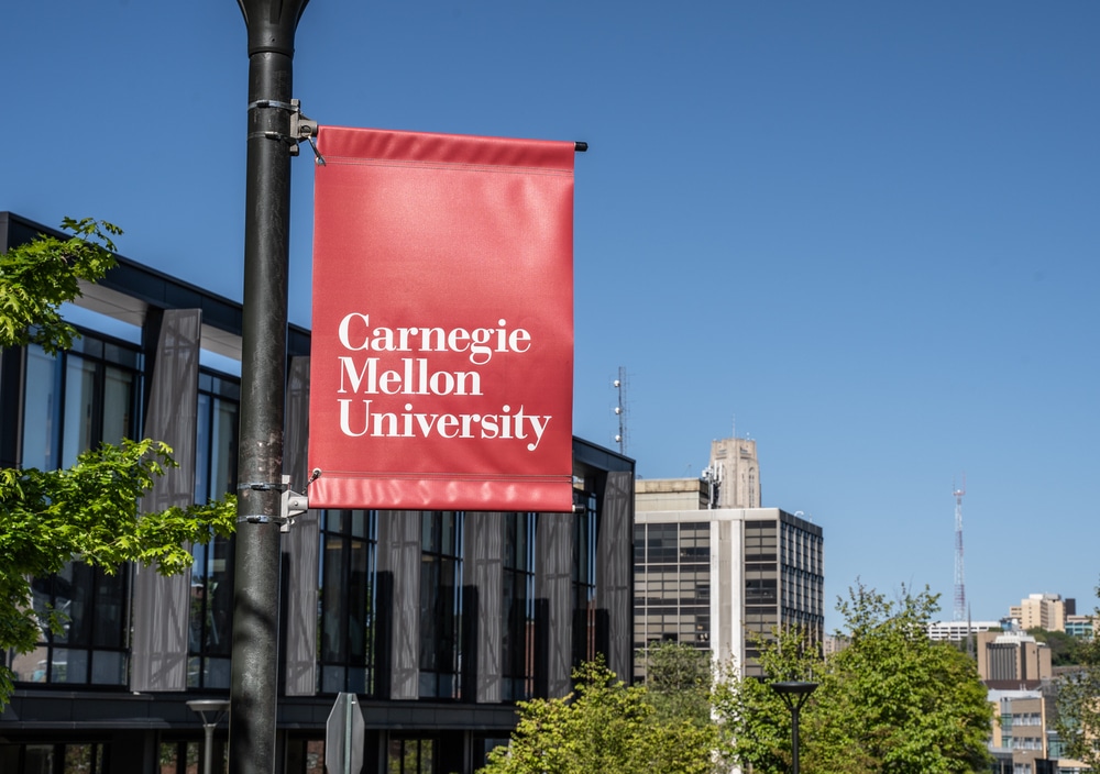 Signage of Carnegie Mellon placed on a building.