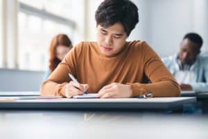 Writing in a desk in a table.