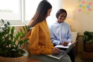 Two students attending an online class.