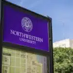 Northwestern University sign with campus map welcome students as they figure out when do Northwestern decisions come out.