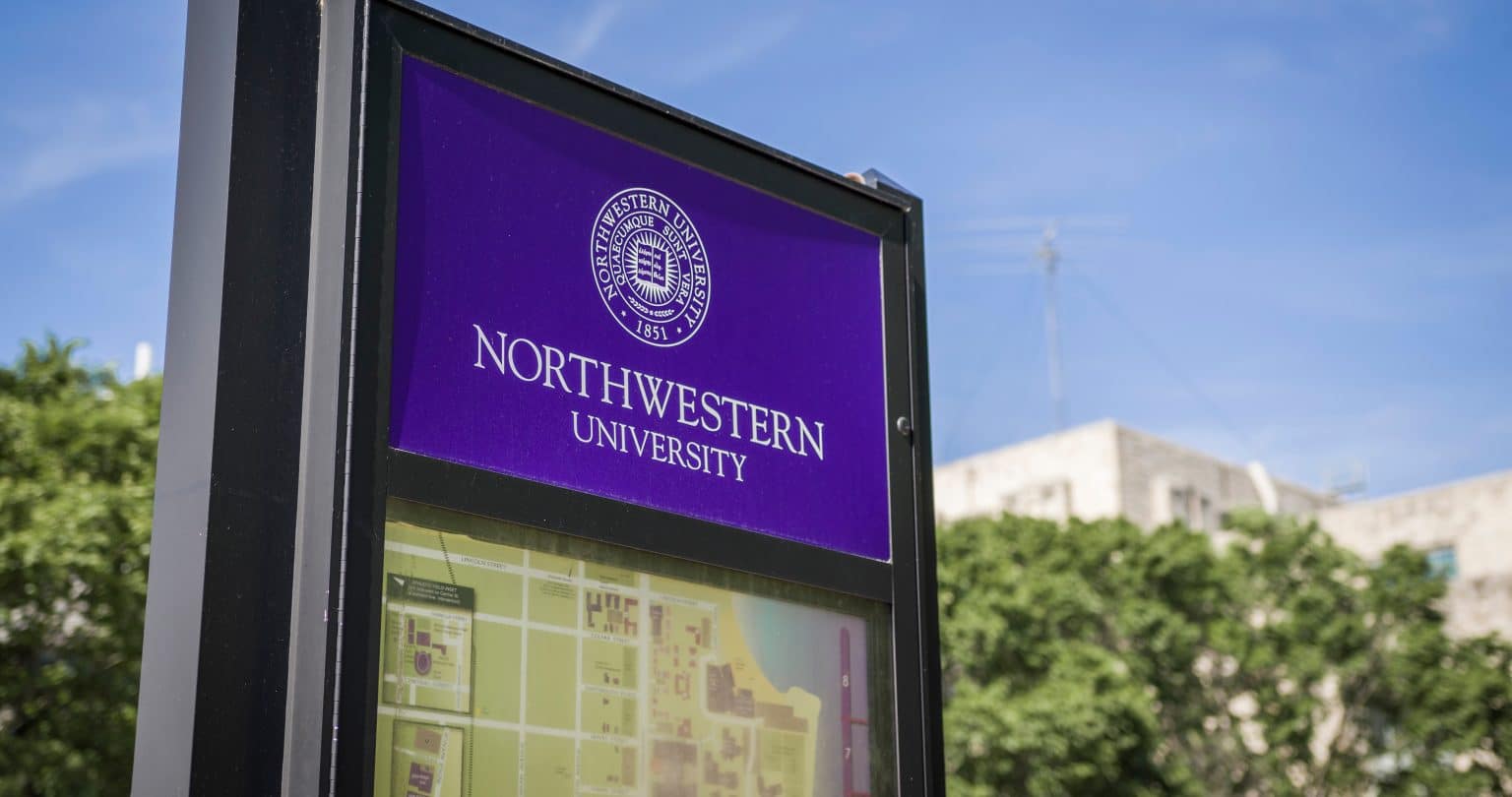 Northwestern University sign with campus map below