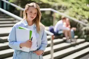 Young woman walking in the stairs of a building.