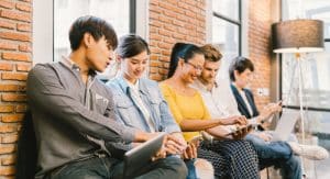 Students sitting on the bench of a school.