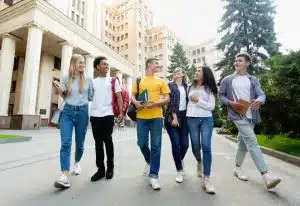 Group of students walking in front of a building.