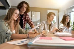 Group of student working on a table.