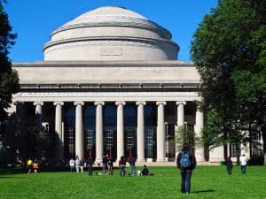 Students walking in front of the main building of MIT.