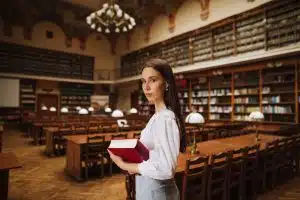 Female law student walking in the library.