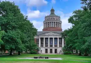 View of University of Rochester building surrounded by trees.
