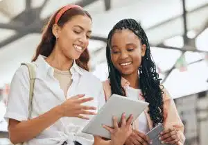 Two students talking and reading.