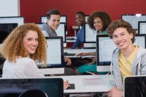 Group of students using a computer.