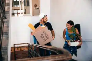 two students moving in to their new dorm room